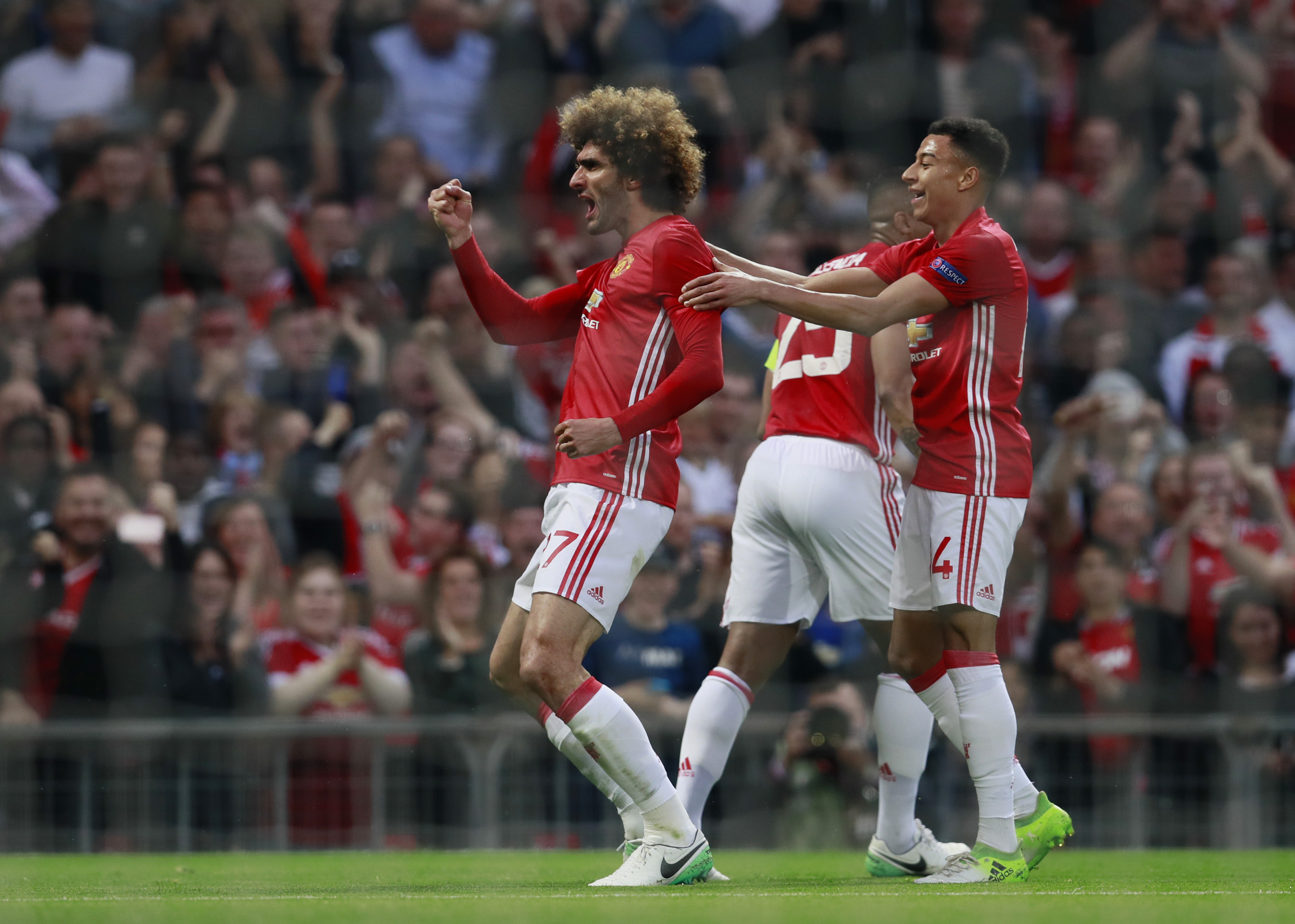 Manchester United's Marouane Fellaini celebrates scoring their first goal with Jesse Lingard - 17-CCT51731