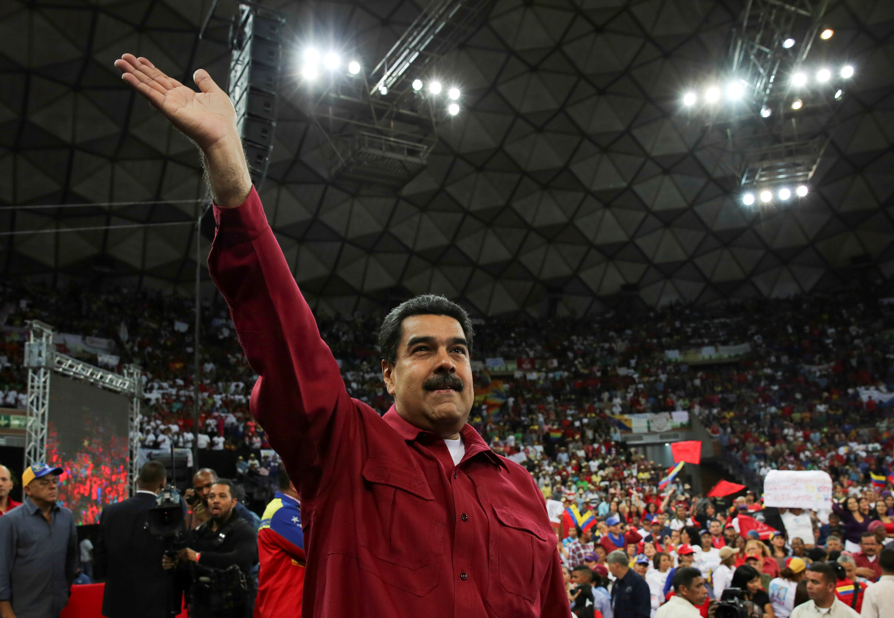 Venezuela's President Nicolas Maduro waves as he attends a gathering in support of him and his proposal for the National Constituent Assembly in Caracas - 3TP